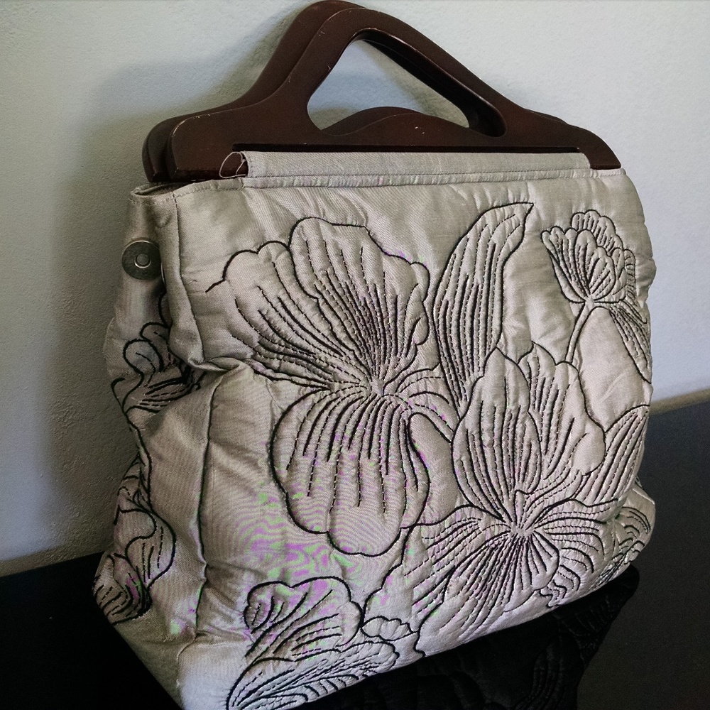 Cute Quilt embroidered purse with wooden handles.